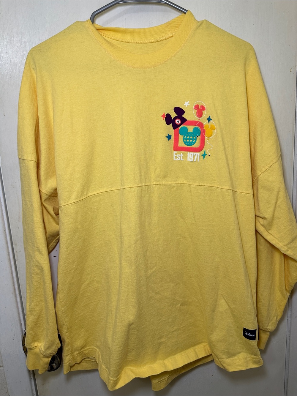 Disney Yellow Graphic Pullover Spirit Jersey Sweatshirt with Colorful Design